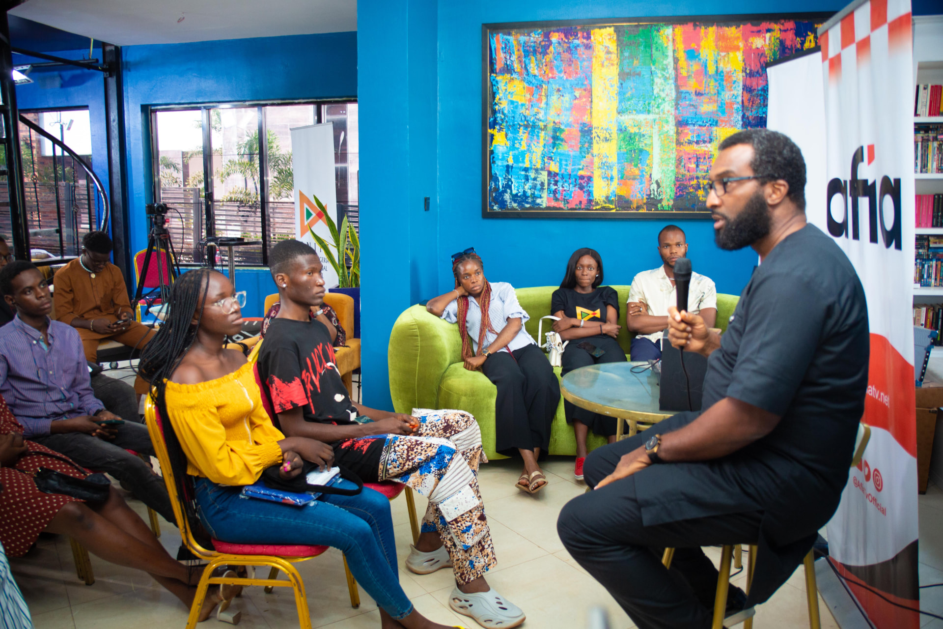 A speaker in conversation with a seated audience at an ENIFF talk